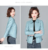 Chic women's sheepskin leather jacket with zippered front, turn-down collar, and pockets for stylish autumn layering.
