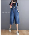 Denim jumpsuit with suspenders paired with heels for dressed up casual spring summer outfit