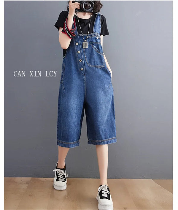 Denim jumpsuit with suspenders paired with heels for dressed up casual spring summer outfit