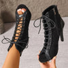 Voesnees stage boots with lace-up aesthetic and super-high heels for dramatic silhouette