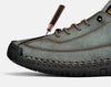 Pair of handcrafted leather slip-ons displayed showing true-to-size fit and modern masculine design