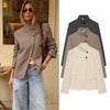 Elegant stand-collar blazer in neutral tone displayed on white background