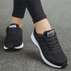 Breathable white running sneakers featuring multi-color design elements