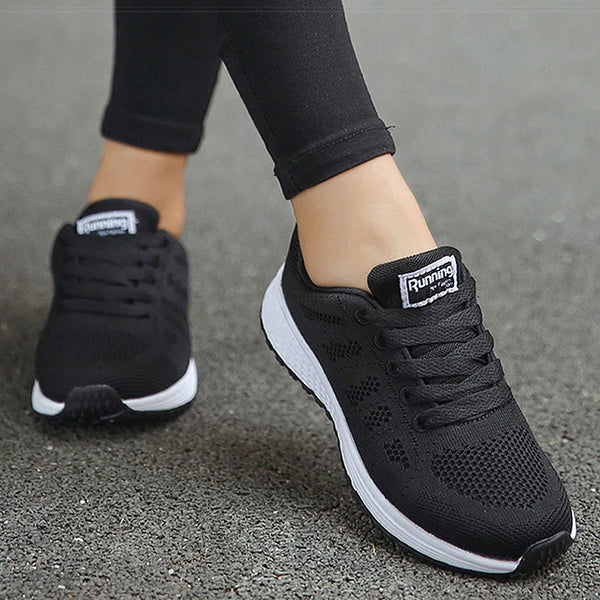 Breathable white running sneakers featuring multi-color design elements