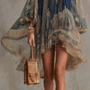White embroidered mini dress featuring romantic puff sleeves and uneven hemline