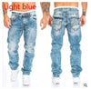 Model showcasing the comfort fit of Midnight Rhythms jeans during city adventures.