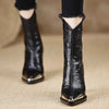 Sleek black ankle boots with mirror-shine patent finish and stable block heel