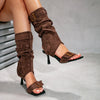 Trendy open-toe boots combining denim and suede for dimensional style