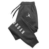 Full-length athletic pants with distinctive printed design for men and women