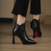 Black pointed leather pumps with silver belt buckle detail and thin high heel