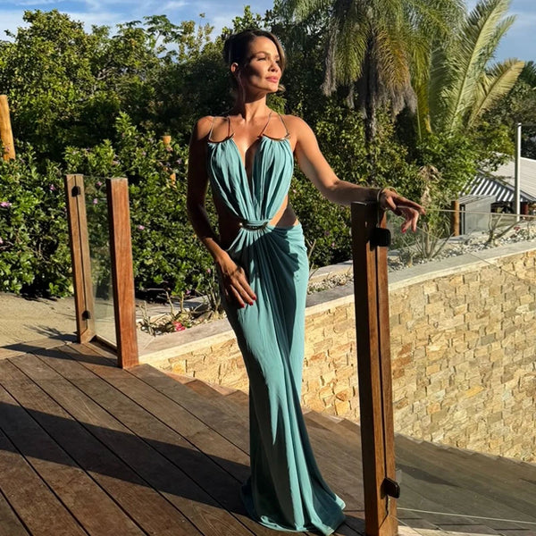 Evening wear halter dress with daring open back and modern side cutout styling