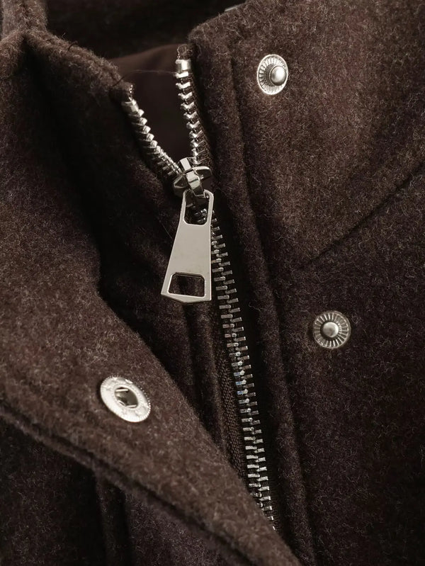 Belted jacket showing relaxed silhouette and flattering waist definition