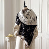 Artful floral design on a soft cashmere shawl, ideal for chilly evenings.
