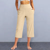 Chic high-waist wide-leg capri yoga pants with pockets, perfect for activewear and casual outings in nylon-spandex blend.