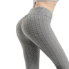 Close-up of seamless anti-cellulite texture on high waist push-up yoga leggings in navy blue.