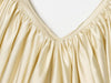 Backless slip top with textured pleating and sophisticated V-neckline