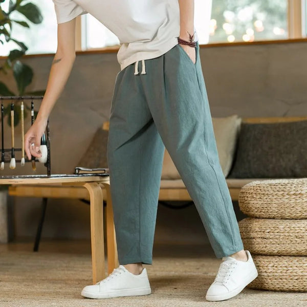 Man in lightweight joggers working from home in comfortable casual attire