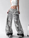 Trendy high-waist wide-leg ripped jeans for women with tie-dye and distressed detailing, perfect for casual street style.
