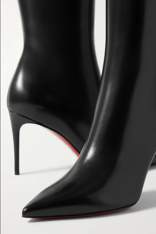 Handmade black stiletto boots with a snug side zipper.