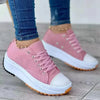 White canvas platform shoes with 3-5cm heel and secure lace-up fit