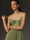 Sophisticated black suspender dress with pleated skirt and vintage charm detailing