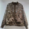 Sleeve detail showing embroidered sequin pattern and regular-fit construction