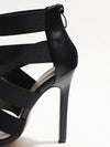 Elegant gold stiletto heels with a zip-up back, ideal for festive occasions.