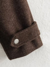 Women's autumn outerwear with zip-front closure and defining waist belt
