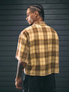 Classic yellow plaid shirt with turn-down collar perfect for spring and summer wear