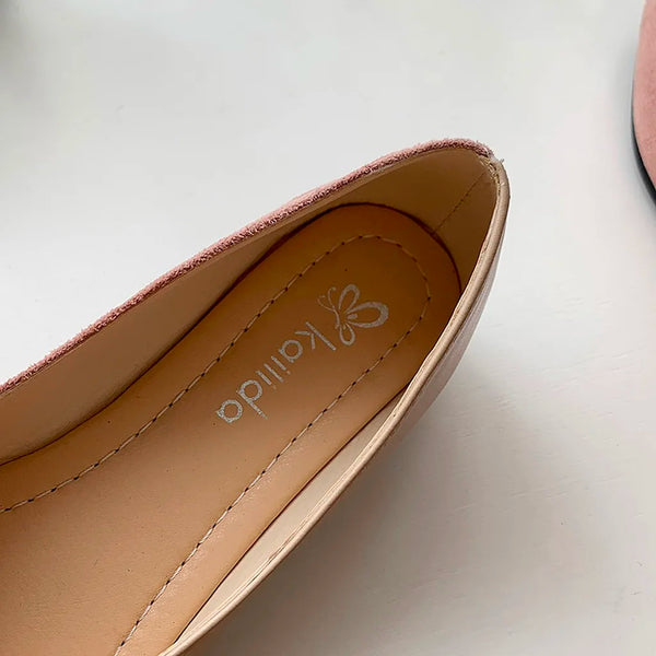 Side profile of pointed toe knitted ballet flats showing elegant silhouette