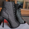 Front view of snake-print stiletto ankle boots with pointed toe