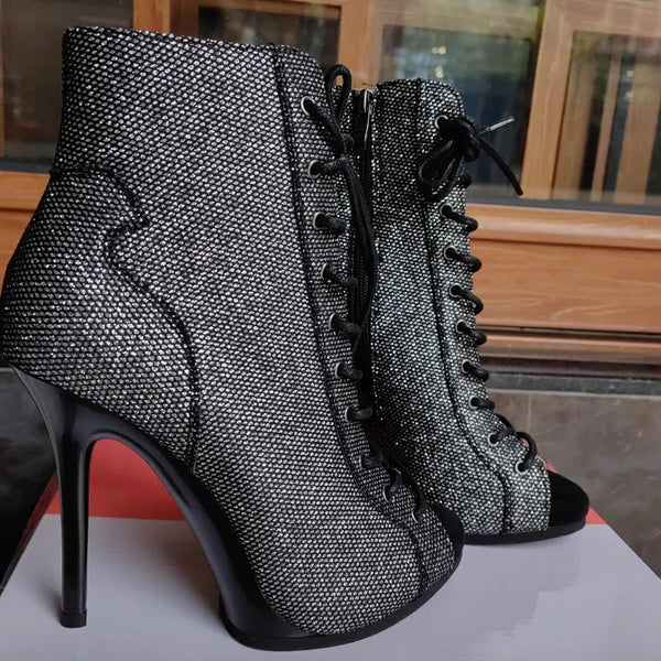 Front view of snake-print stiletto ankle boots with pointed toe