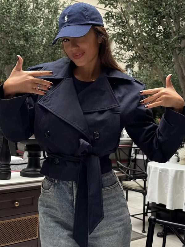 Modern trench coat featuring adjustable belt and turn-down collar