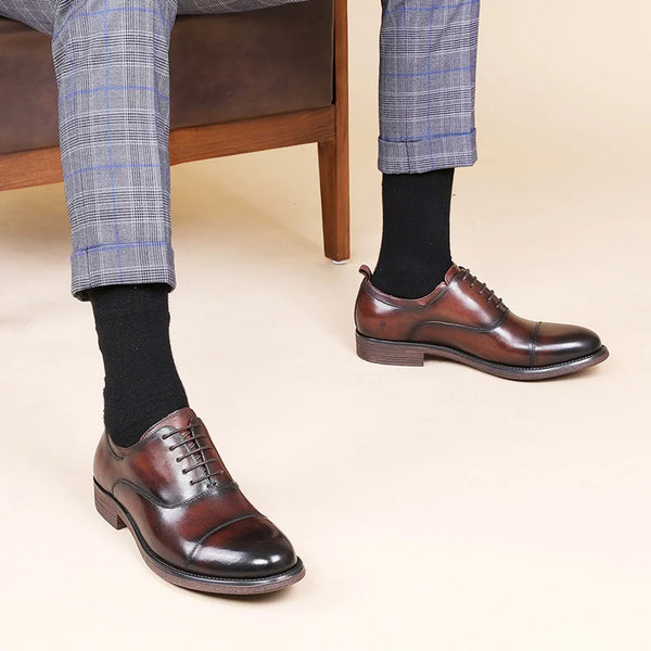 Side view of handmade leather Oxford flats showing sleek professional silhouette