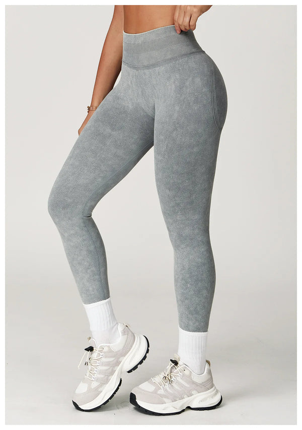 Dusty rose high waist yoga pants made from stretchy material.