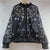 Flat lay of complete embroidered sequin jacket with all design elements visible