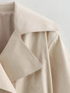 Flattering belted trench coat in versatile neutral tone