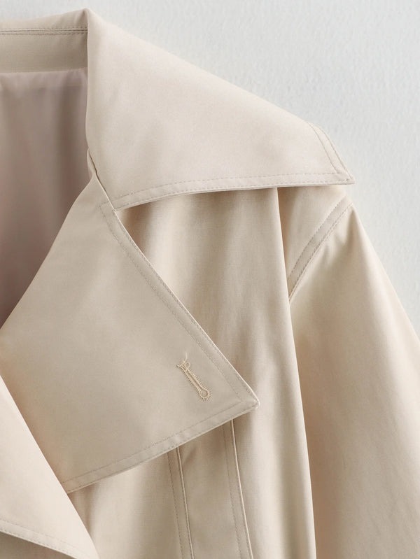 Flattering belted trench coat in versatile neutral tone