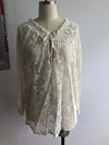 Elegant Boho Lace V-Neck Blouse for women, featuring delicate lace, relaxed fit, and lightweight fabric for spring and summer