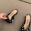 Comfortable flat sandals with sleek pointed toe and secure elastic closure system