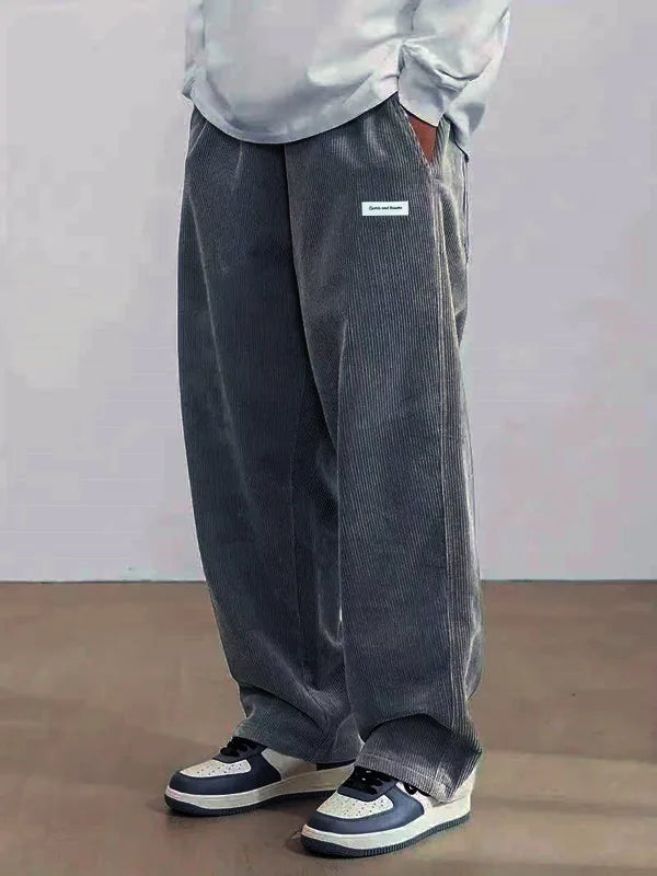 Soft polyester corduroy pants featuring drawstring waist and breathable loose fit design