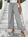 Floral wide-leg chiffon pants for women, ankle-length, elastic waist, perfect for summer fashion and casual chic outfits.