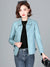 Chic women's sheepskin leather jacket with zippered front, turn-down collar, and pockets for stylish autumn layering.