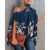 Elegant floral print blouse with batwing sleeves, halter collar, and soft cotton-polyester blend for all-day comfort.