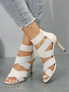 Chic gold open-toe stiletto sandals with thin heels for evening wear.