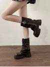 Chic women's mid-calf biker boots with buckle detail, cozy plush lining, and durable rubber sole for stylish winter wear.