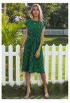 Pleated midi dress in classic polka dot print for summer occasions