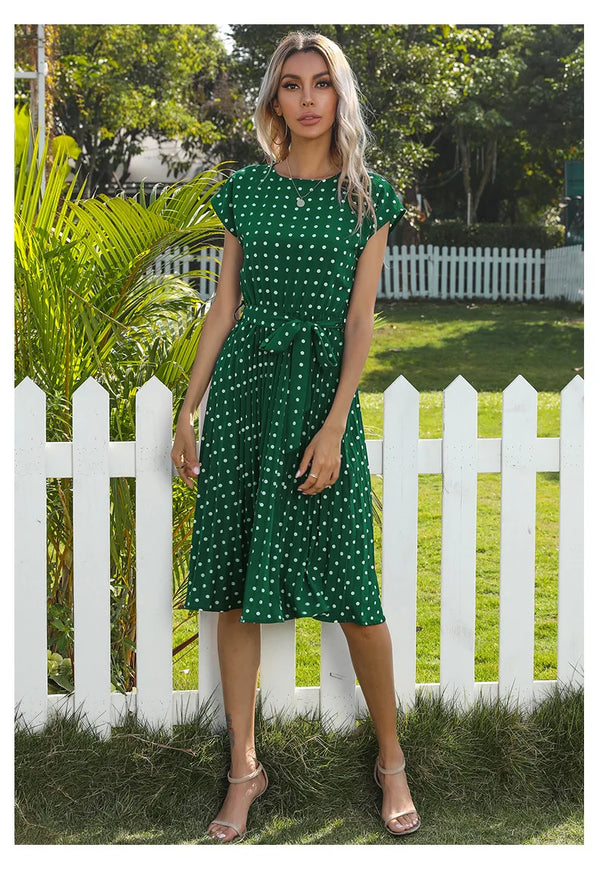 Pleated midi dress in classic polka dot print for summer occasions