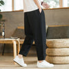 Man wearing lightweight joggers with white tee and sneakers for casual everyday style