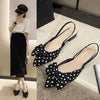 Refined pointed toe sandals featuring elastic band closure and butterfly-knot accent
